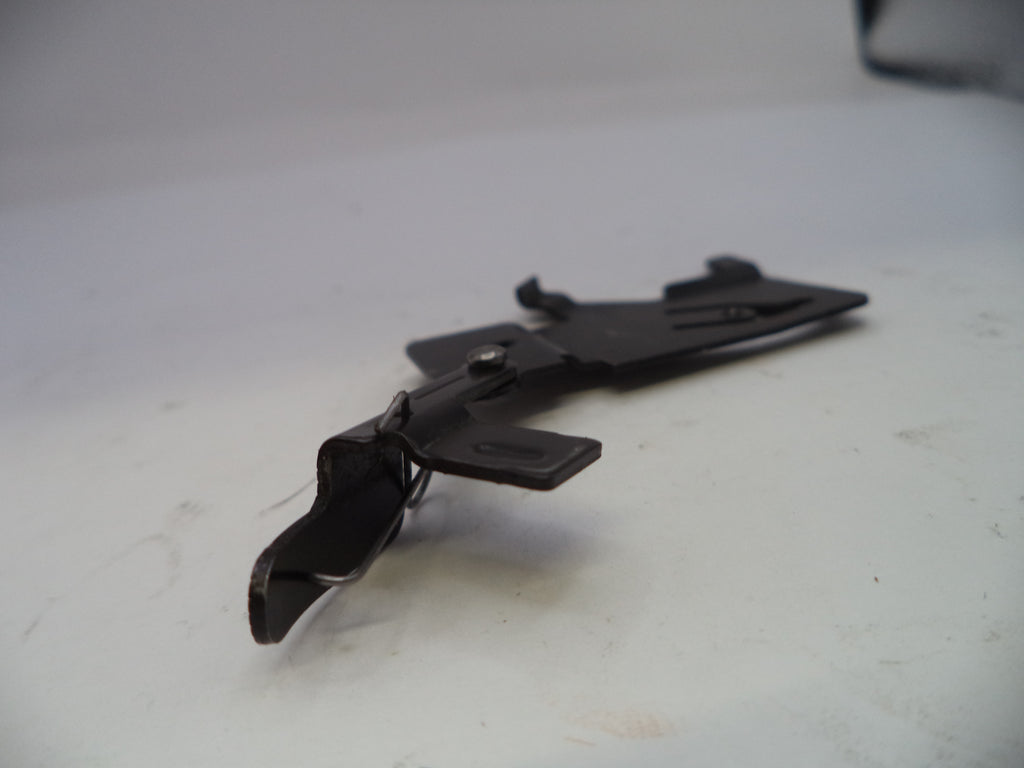 Black metal clip on a white surface