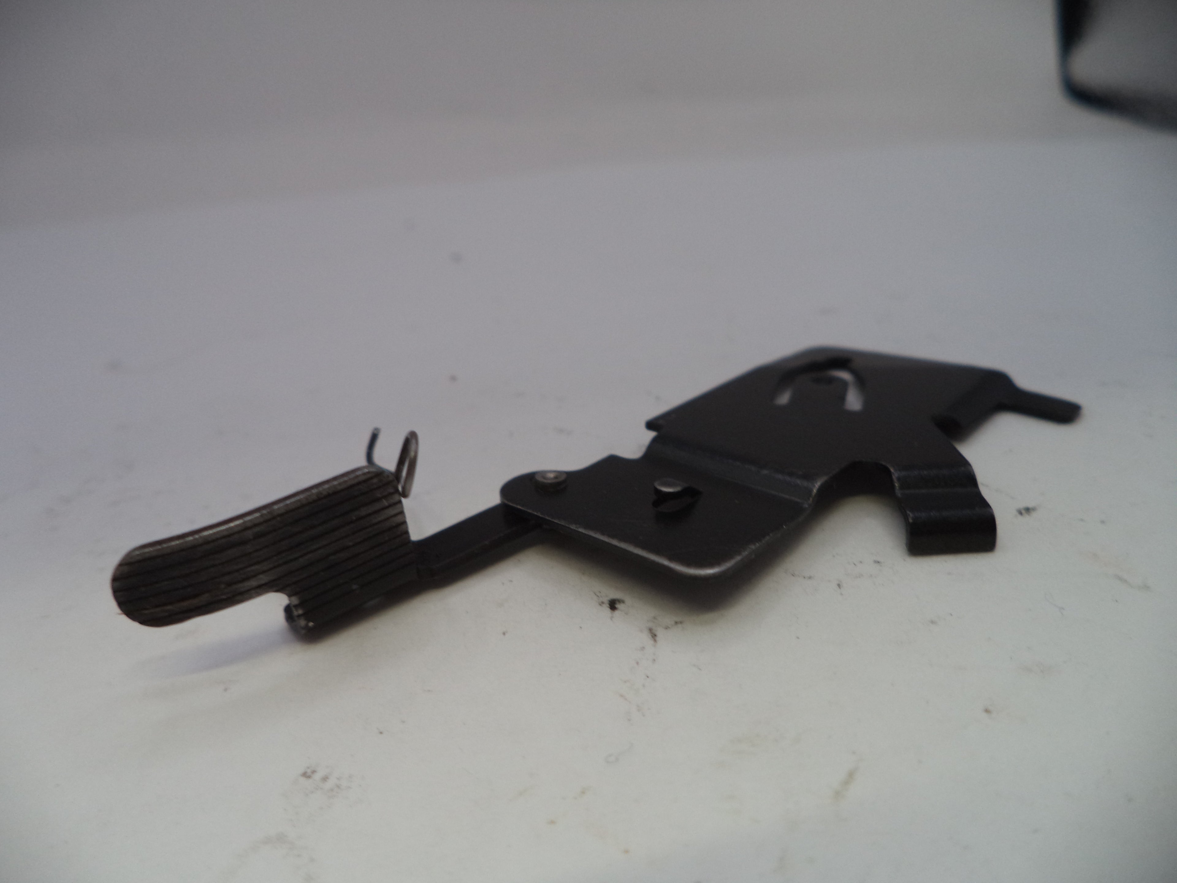 Black metal tool on a white surface
