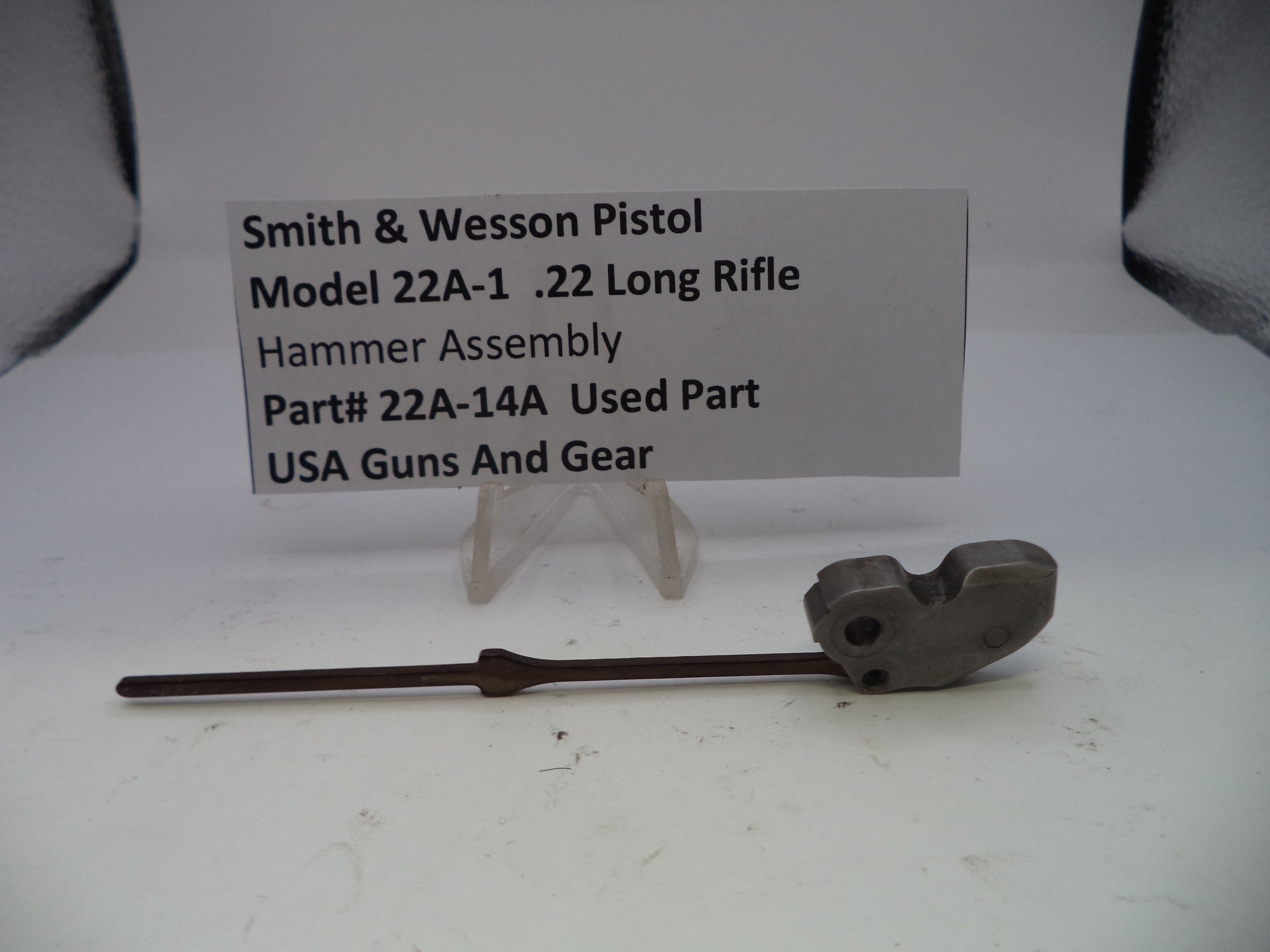 Smith & Wesson Pistol Model 22A-1 .22 Long Rifle Hammer Assembly on a white background with a label.