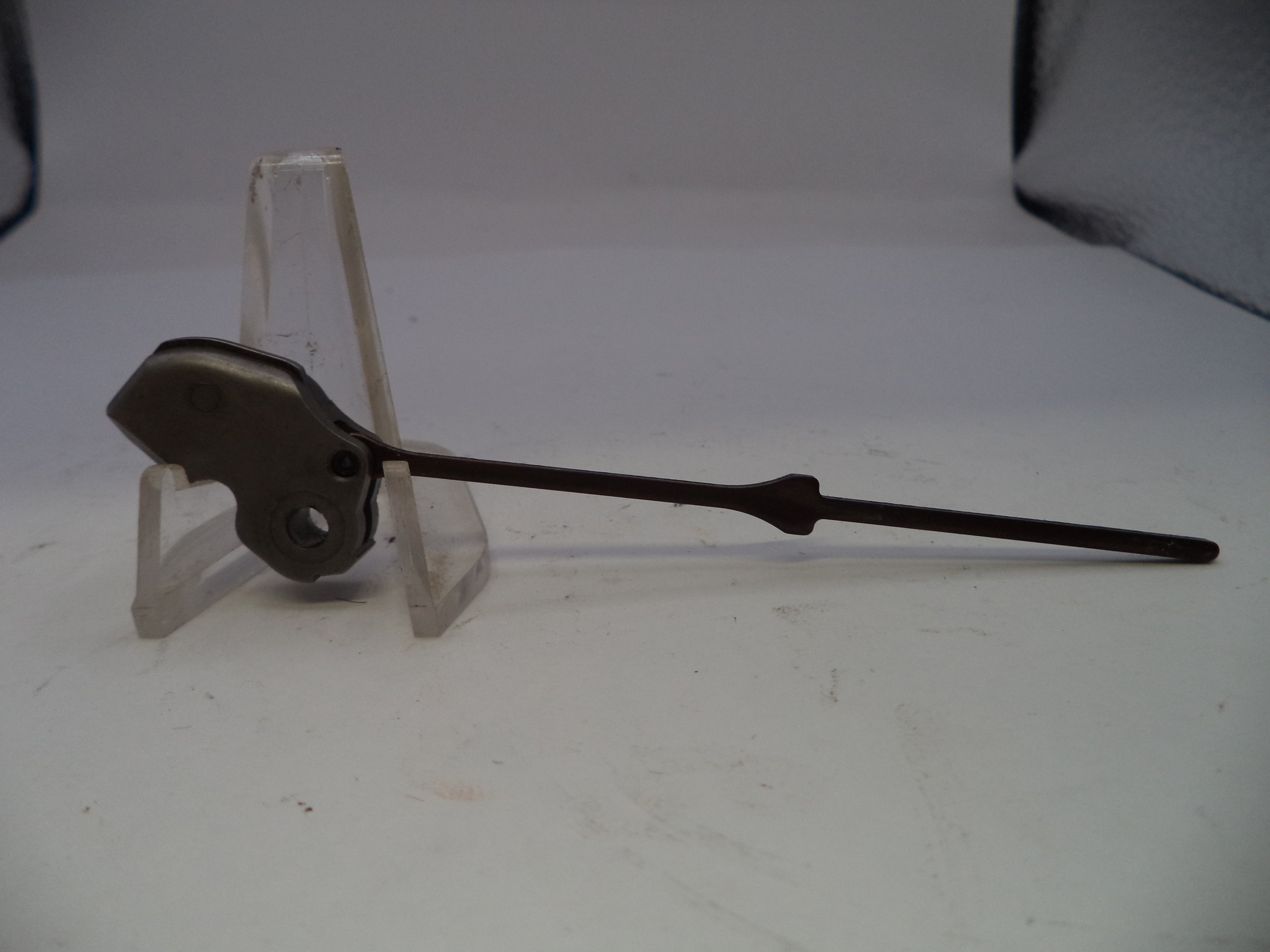 Mechanical component on a stand against a white background