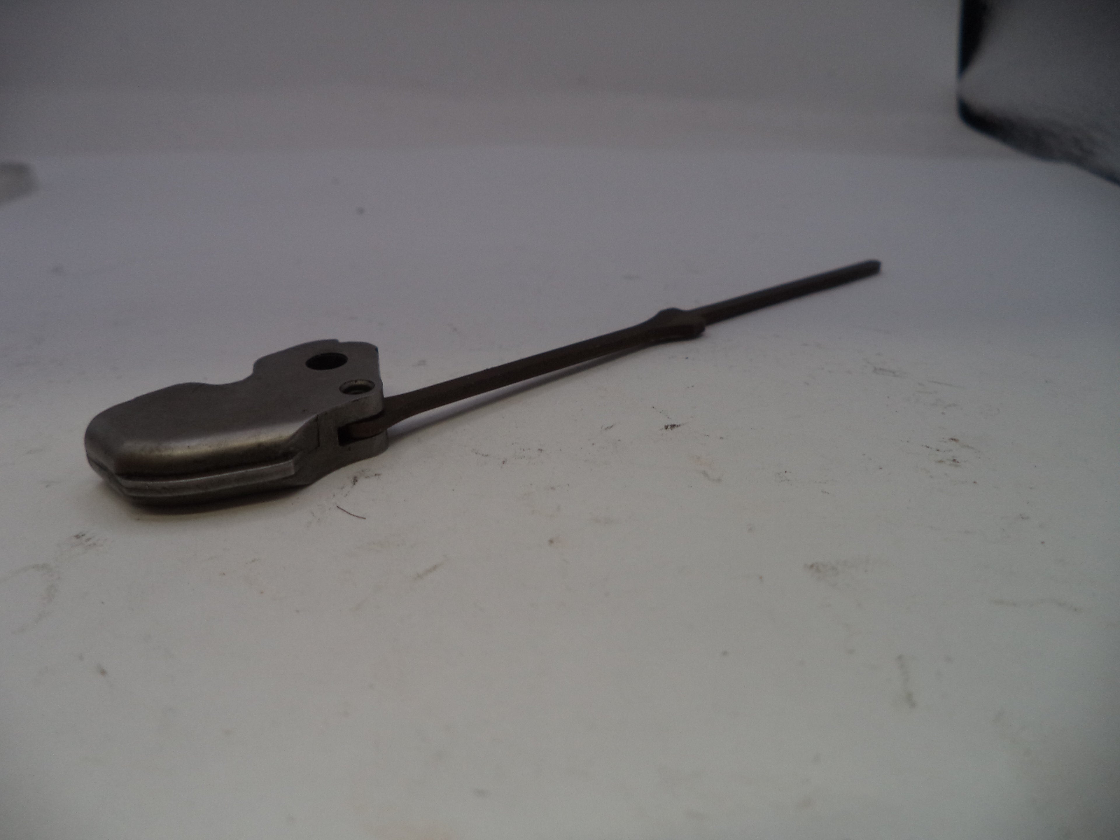 Metal tool on a white surface