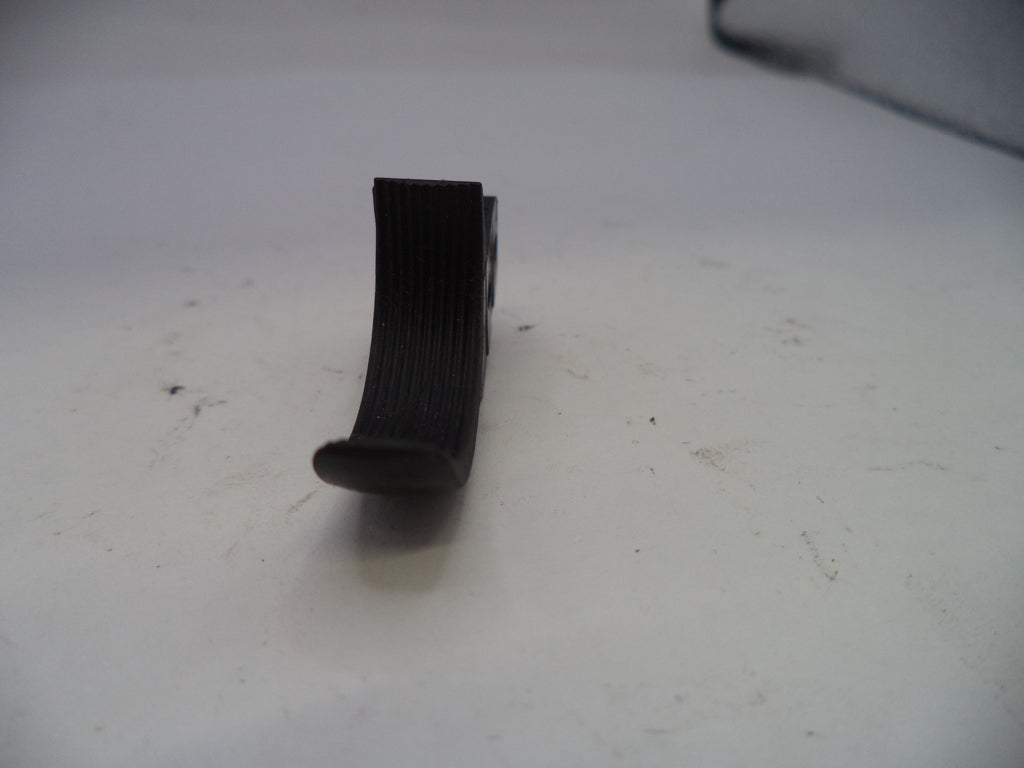 Black ribbed belt on a white surface