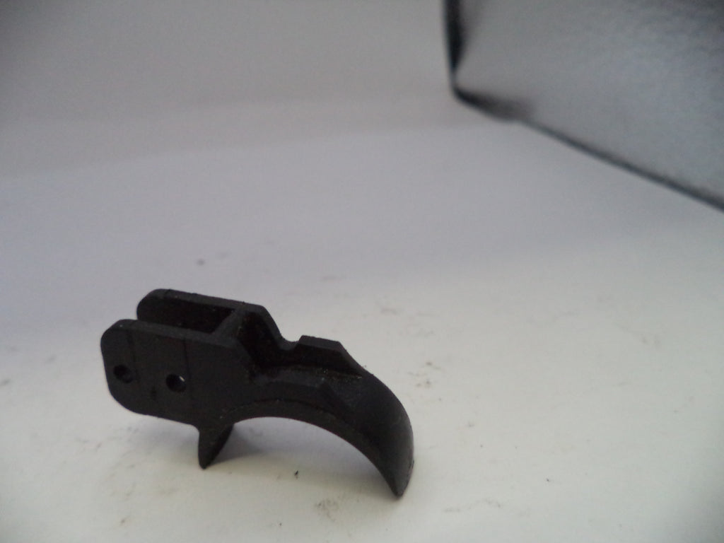 Black metal component on a white surface