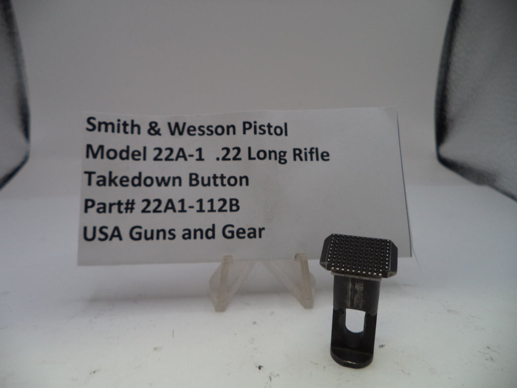 Smith & Wesson pistol takedown button with descriptive card on a white background