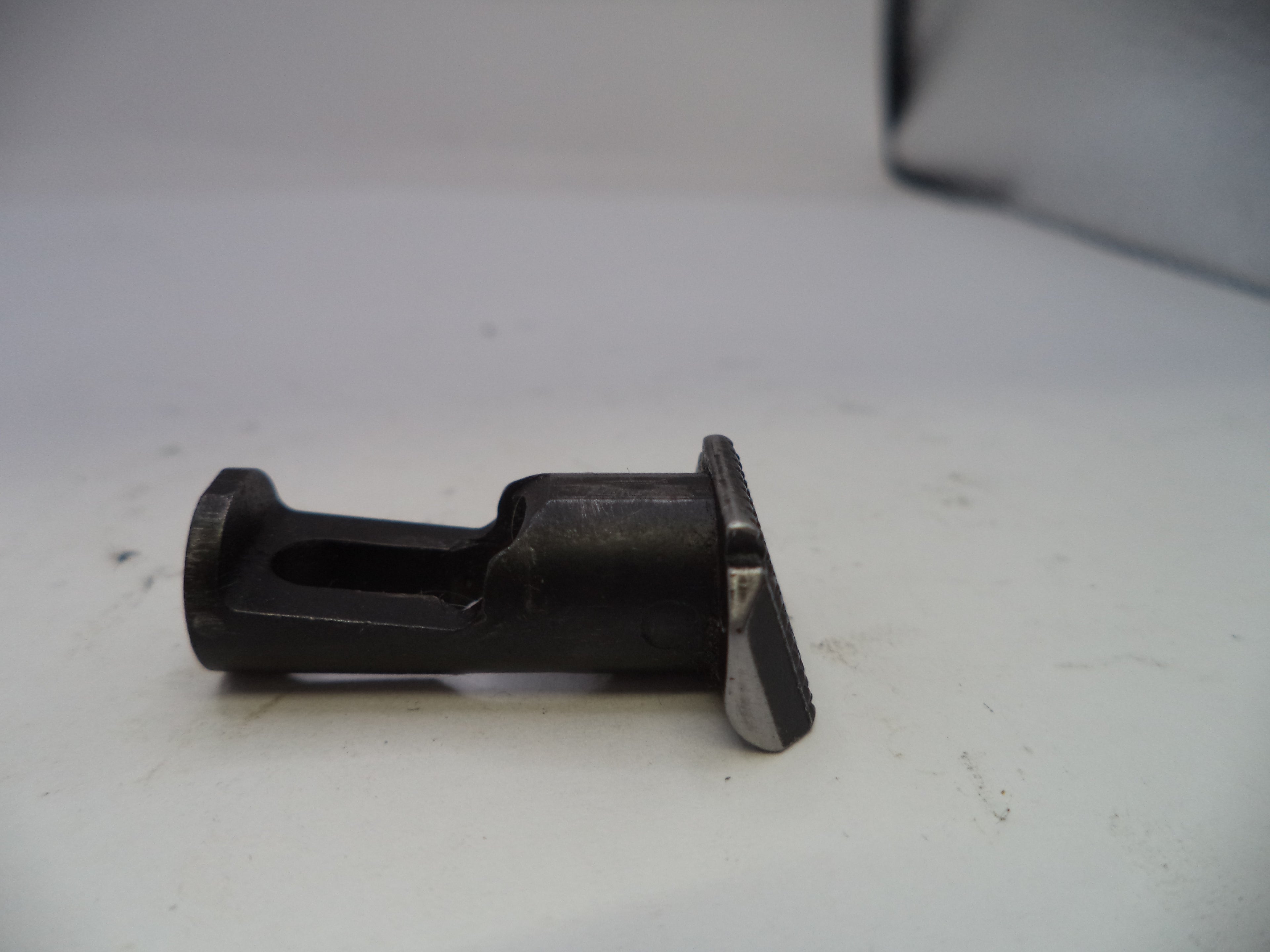 Metal and rubber component on a white surface