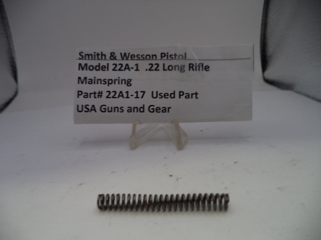 Smith & Wesson pistol mainspring with a label on a white background