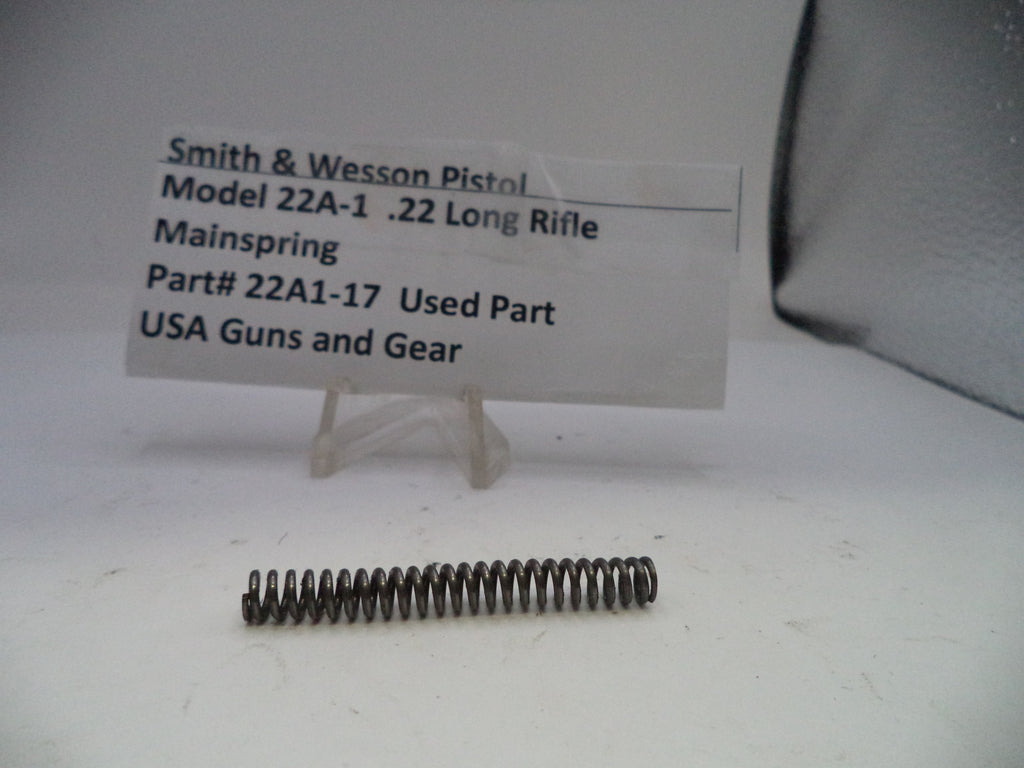 Smith & Wesson pistol mainspring with a label on a white background