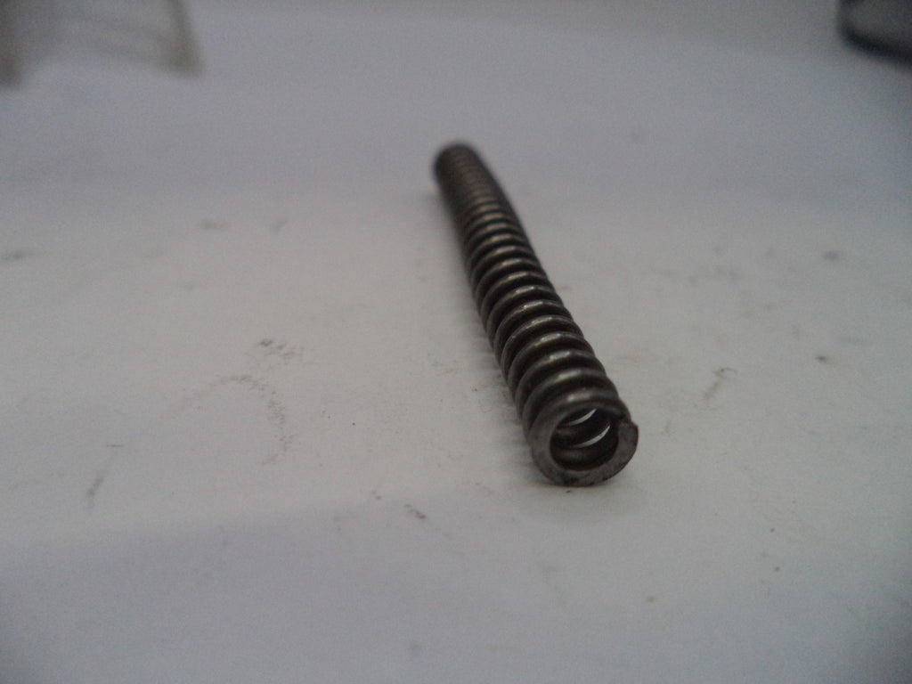Metal spring on a white surface
