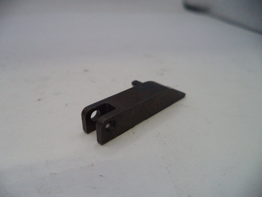 Black metal bracket on a white surface