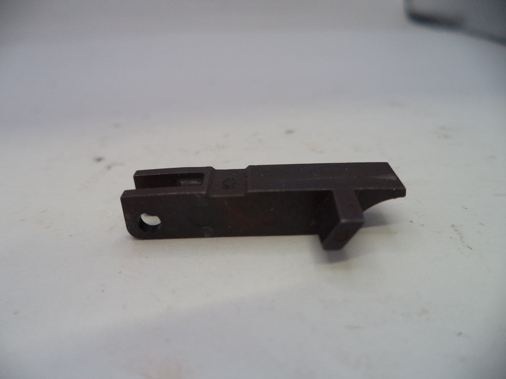 Black metal bracket on a white surface