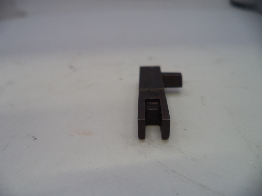 Black metal component on a white surface