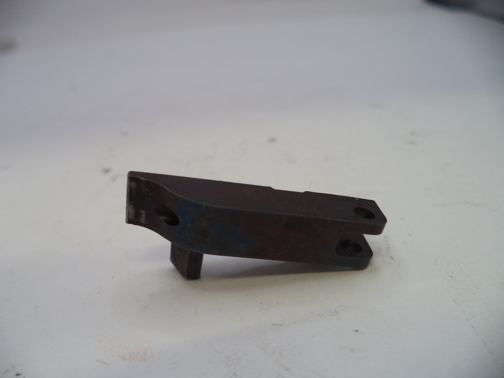 Metal bracket on a white surface