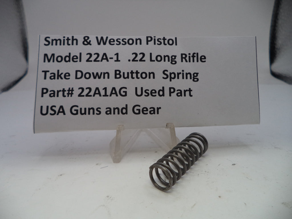 Smith & Wesson pistol part with descriptive label on a white background