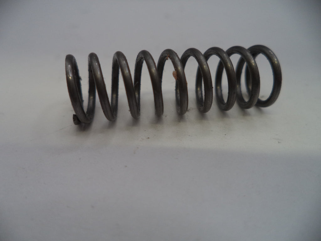 Coiled metal spring on a white background