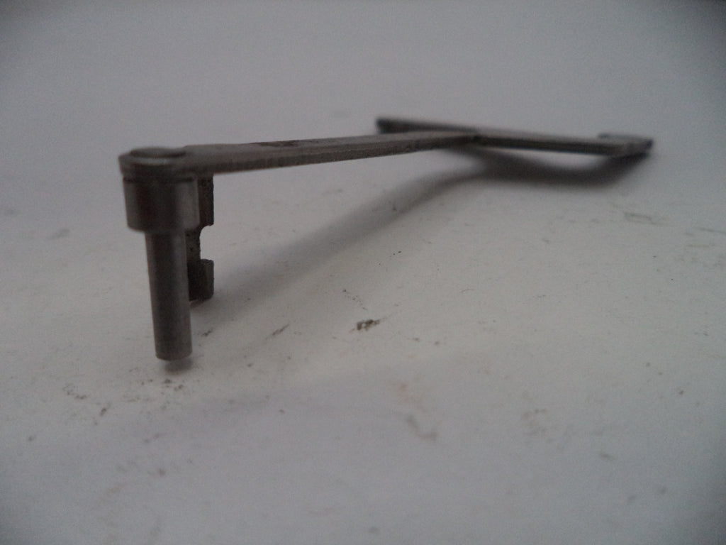 Metal key on a light gray surface