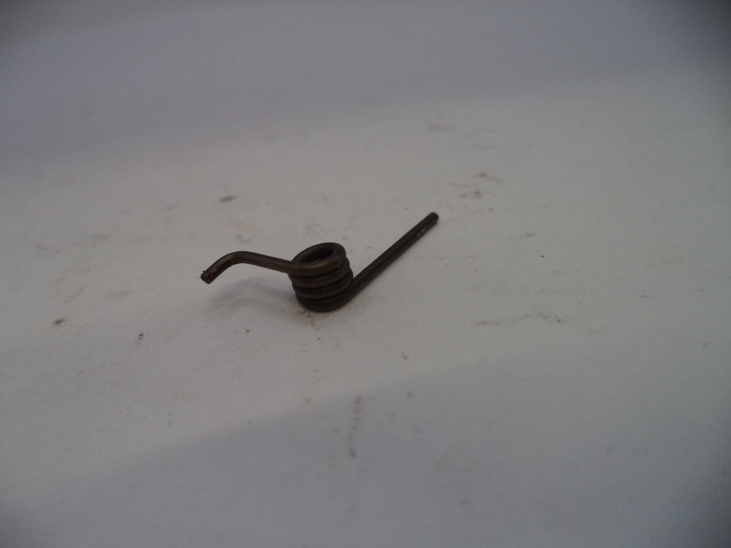 Small metal object on a white surface