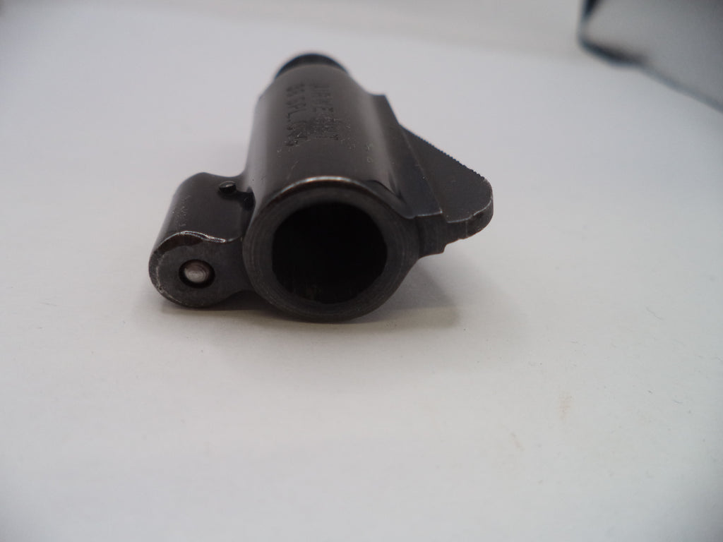 Black mechanical component on a white surface