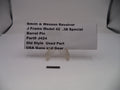 Smith & Wesson revolver barrel pin with a label on a white background