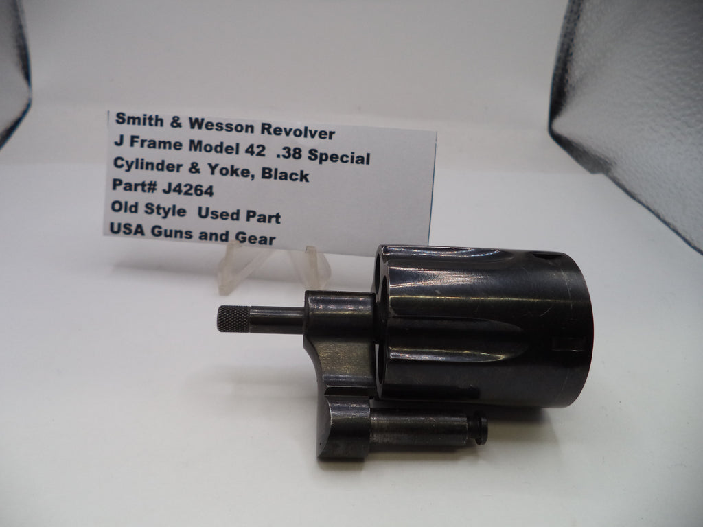Black revolver cylinder and yoke with a label on a white background