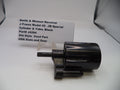 Black revolver cylinder and yoke with a label on a white background