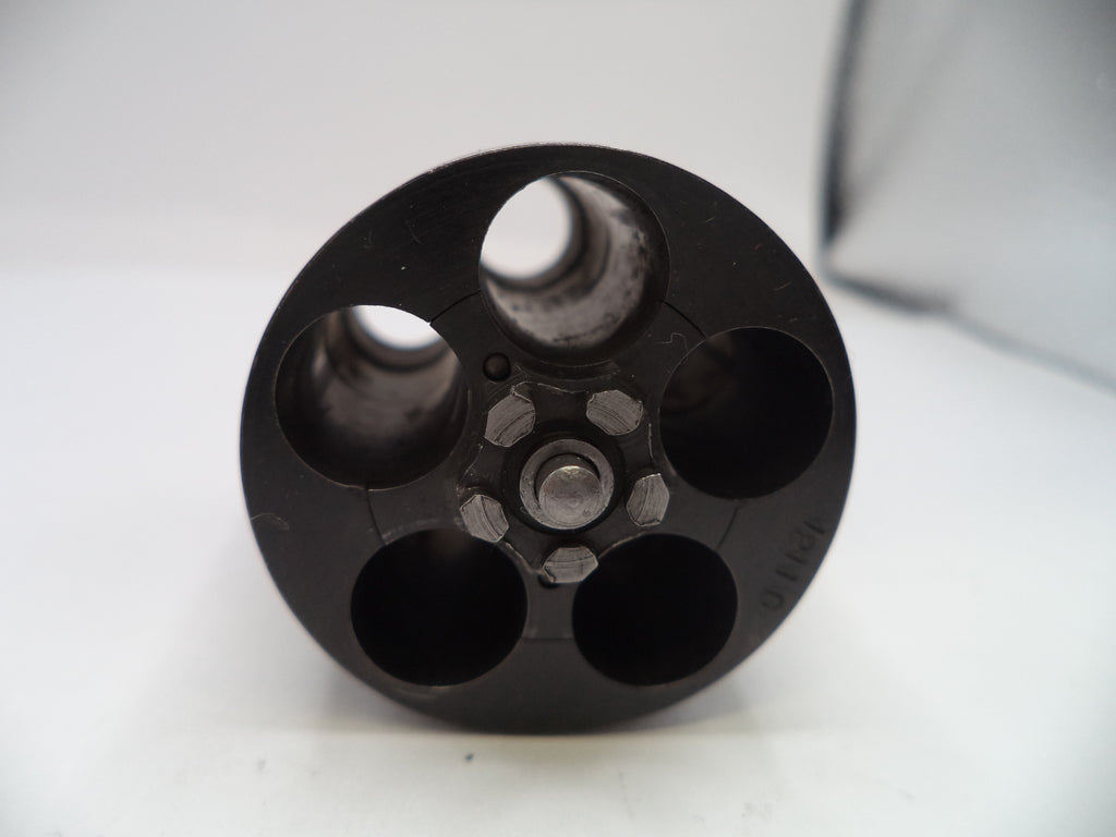 Black cylindrical object with multiple compartments on a white background