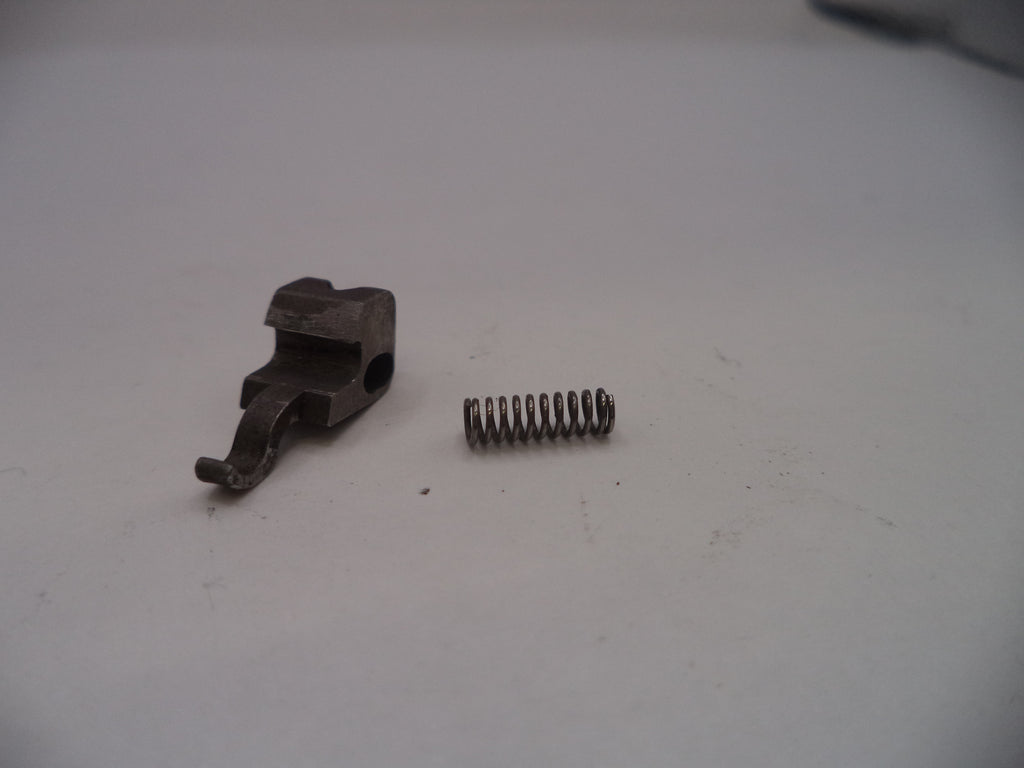 Two metal components on a white surface