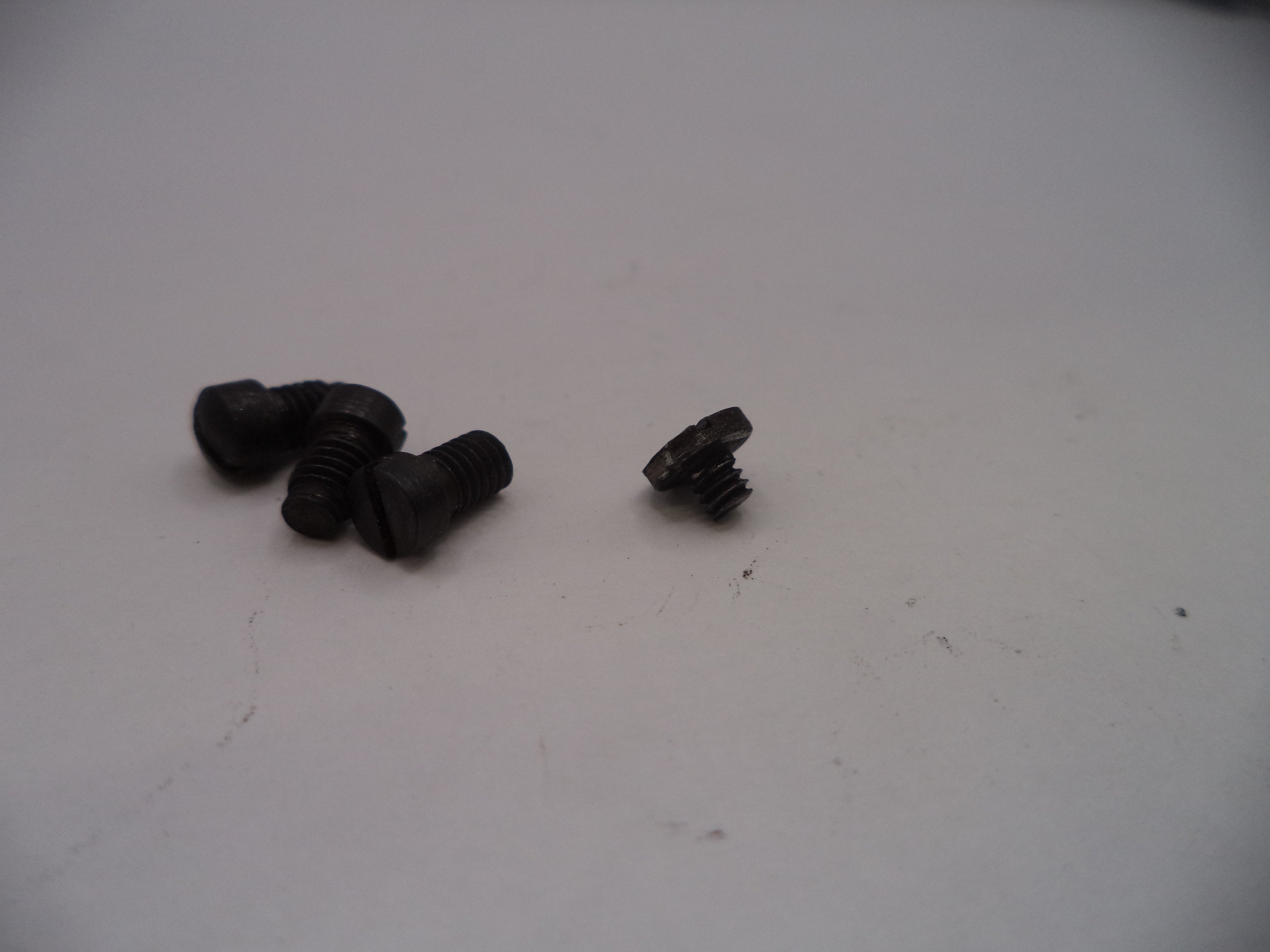 Smith & Wesson J Frame Model 42 Centennial Airweight Side Plate Screws, 4-Screw Type, Black, Old Style, Set of 4 - Part# J42145