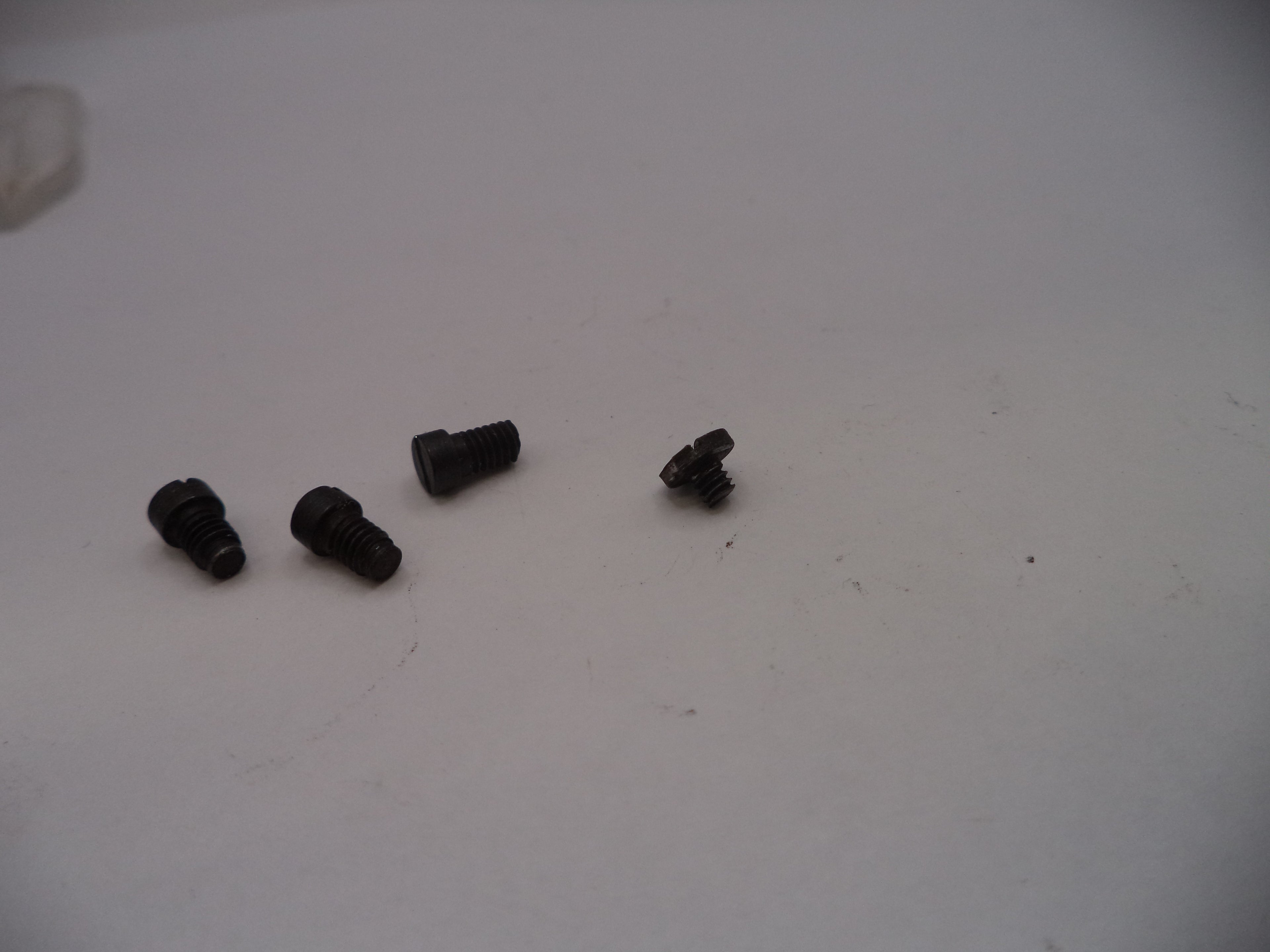 Smith & Wesson J Frame Model 42 Centennial Airweight Side Plate Screws, 4-Screw Type, Black, Old Style, Set of 4 - Part# J42145