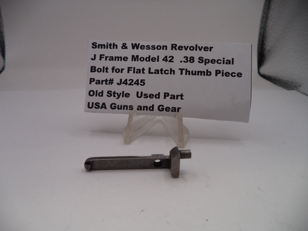 Smith & Wesson revolver part on a stand with a label