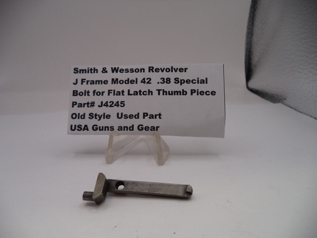 Smith & Wesson revolver part with descriptive card on a white background