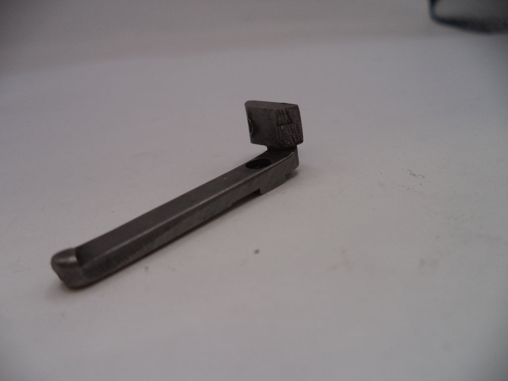 Black metal tool on a light gray surface