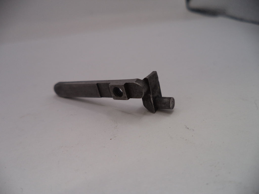 Metallic object on a white surface