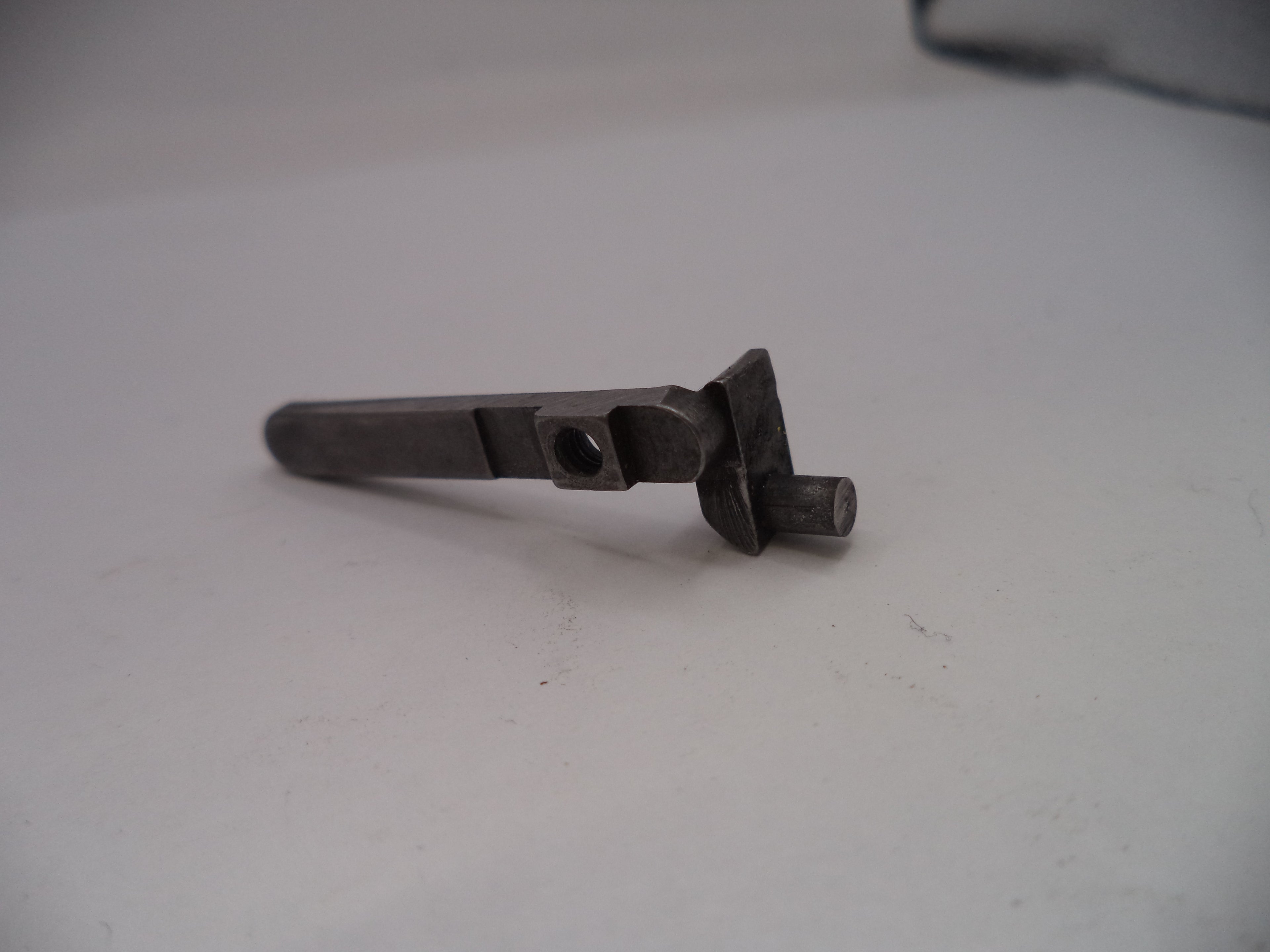 Metallic object on a white surface