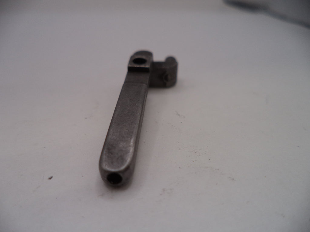 Metal wrench on a white surface