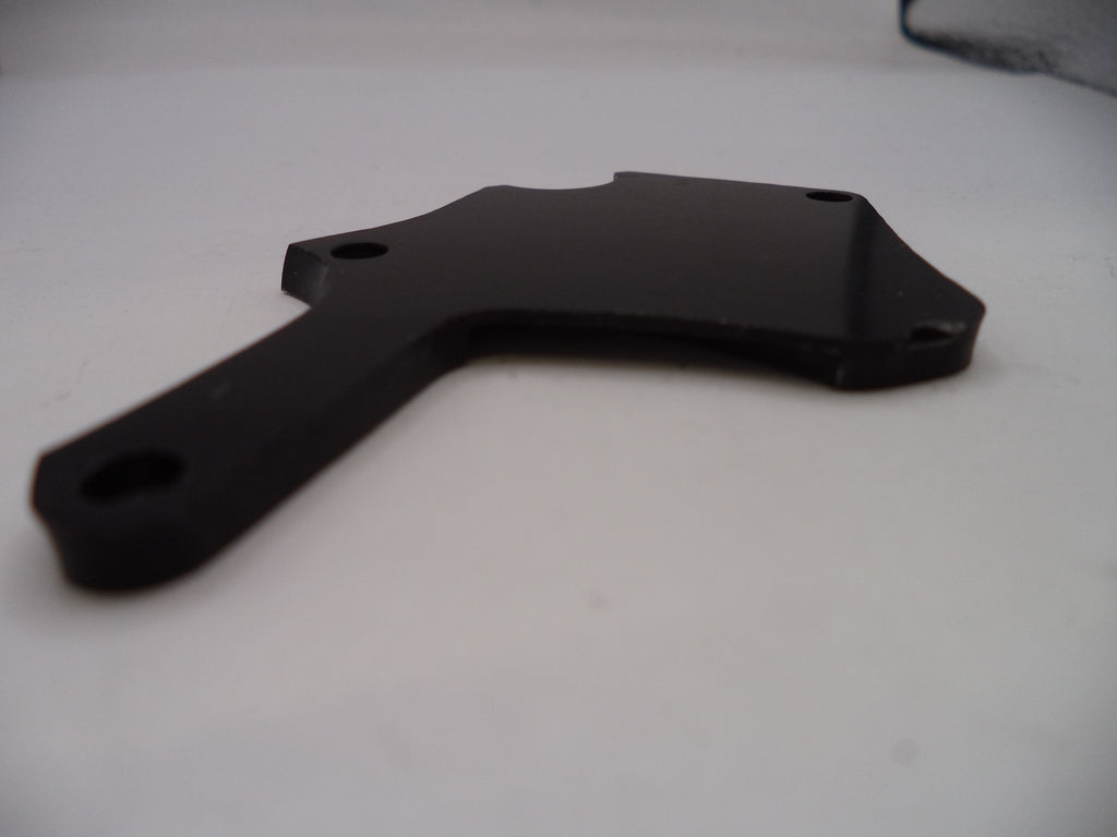 Black metal bracket on a white surface
