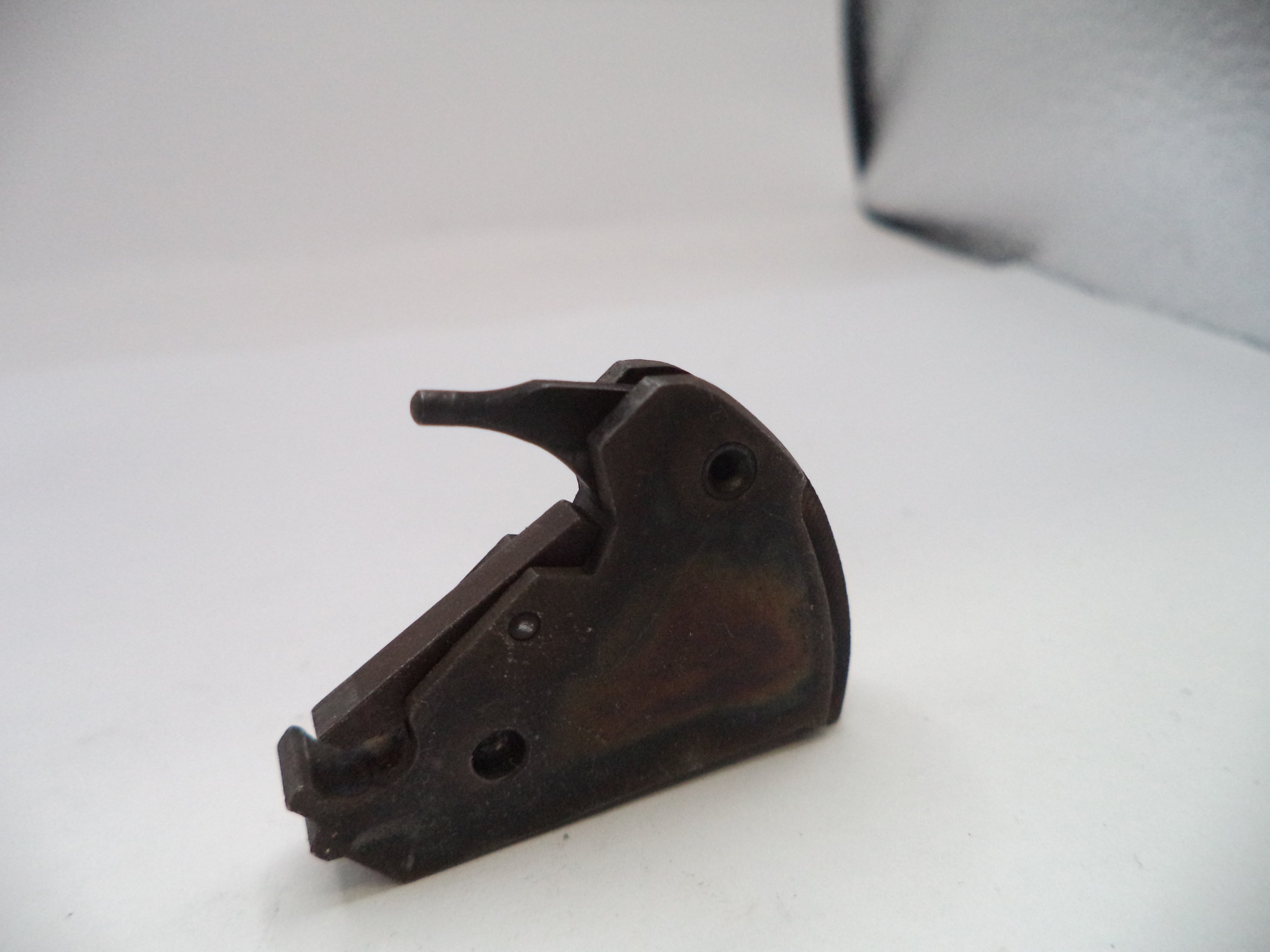 Metal mechanical component on a white surface