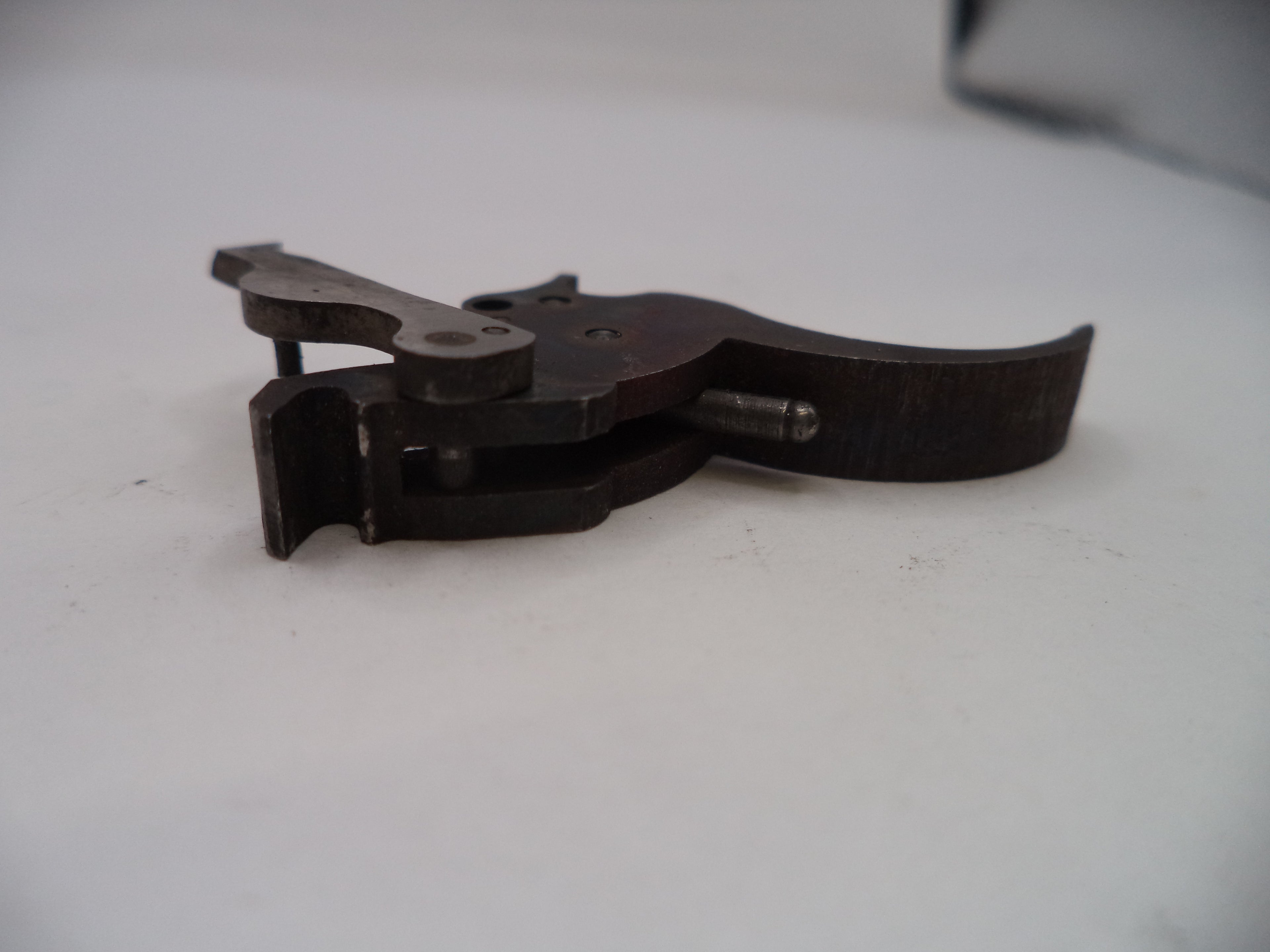 Metal plier-like tool on a white background
