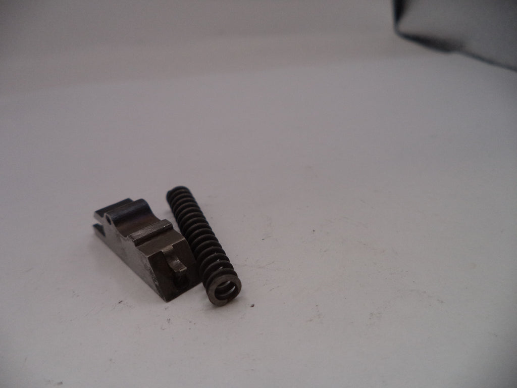 Metal component with a spring on a white background