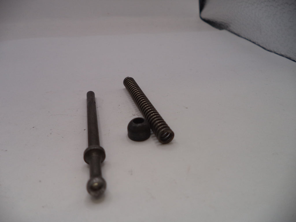 Two metal springs on a white surface