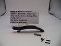 Smith & Wesson revolver part with screws and spring on a white background
