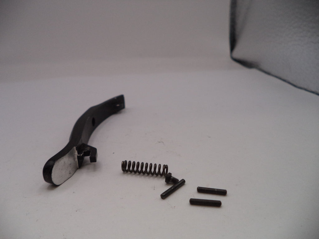 Black metal bracket with springs and screws on a white surface