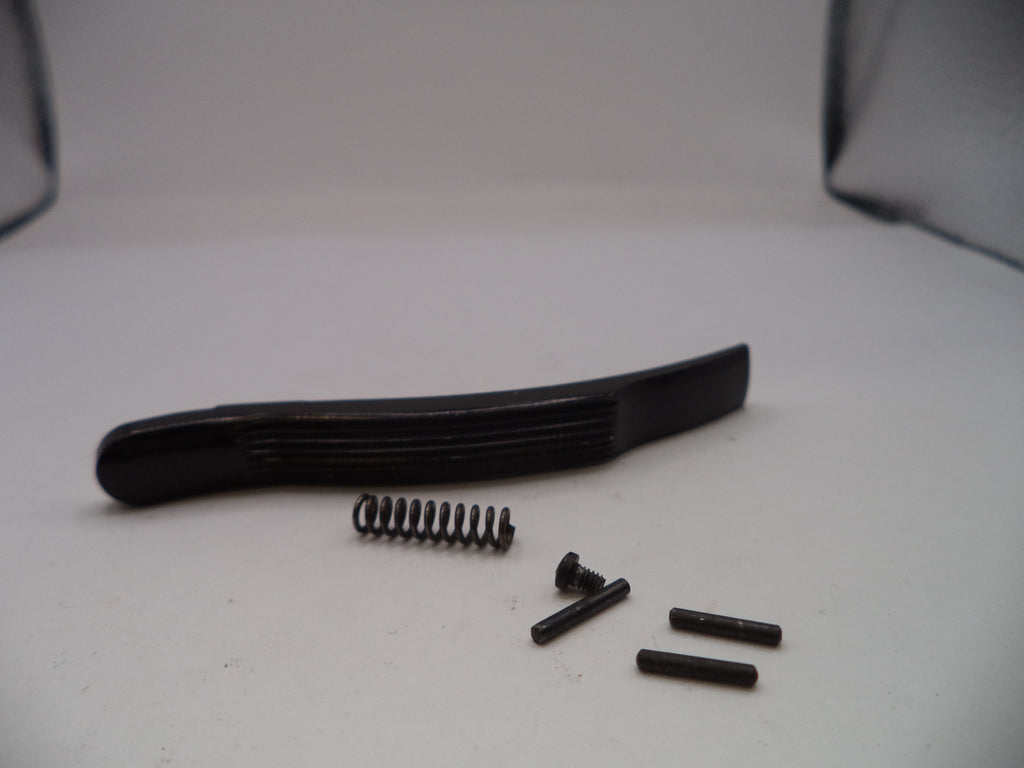 Black plastic component with screws on a white background