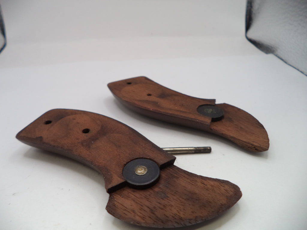 Wooden knife sheaths with metal clasps on a white background