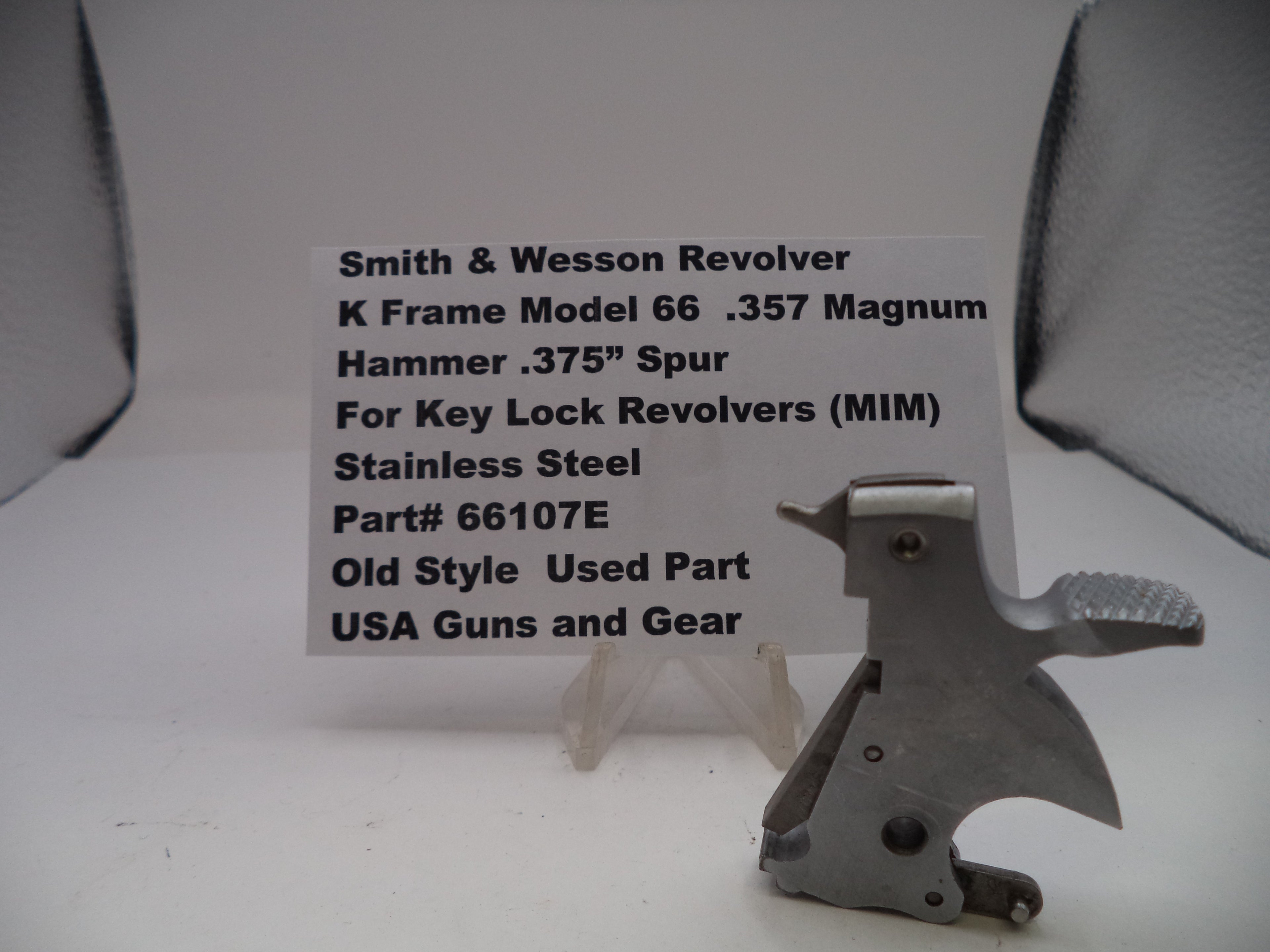 Smith & Wesson revolver part with descriptive text card on a white background