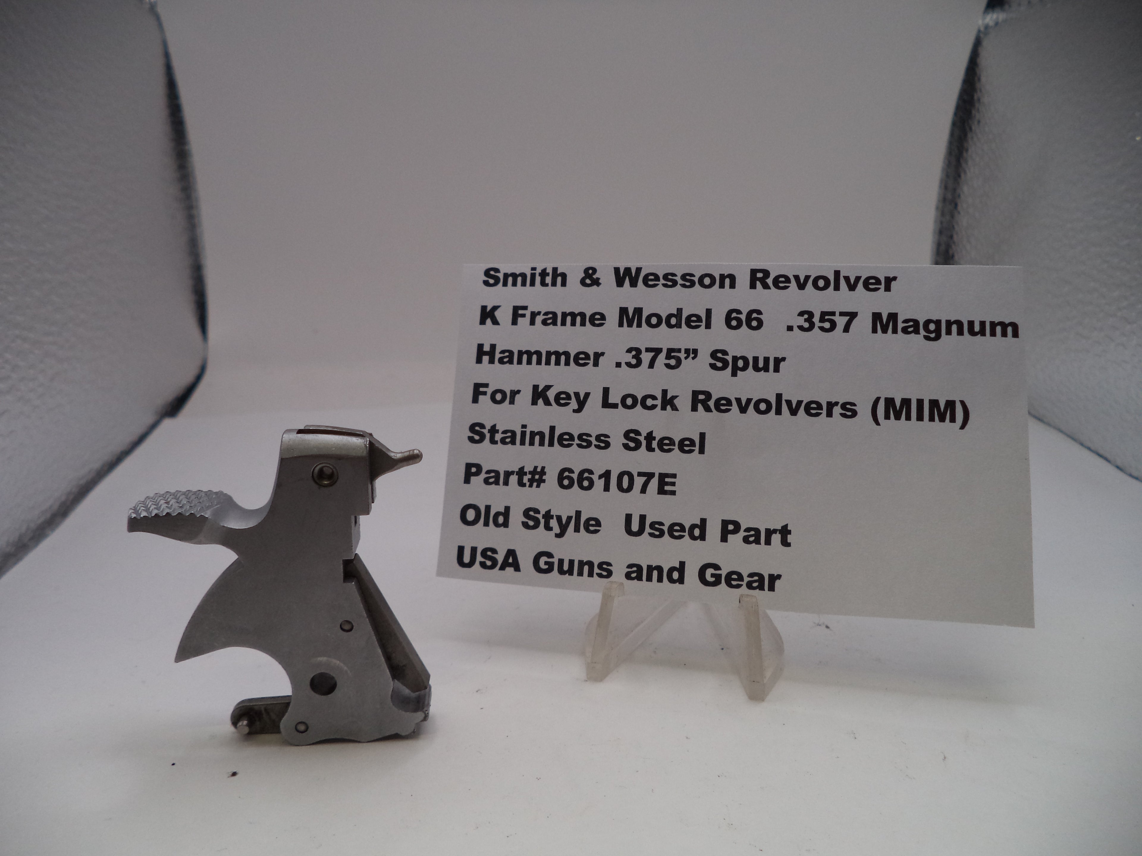Smith & Wesson revolver part with descriptive card on a white background