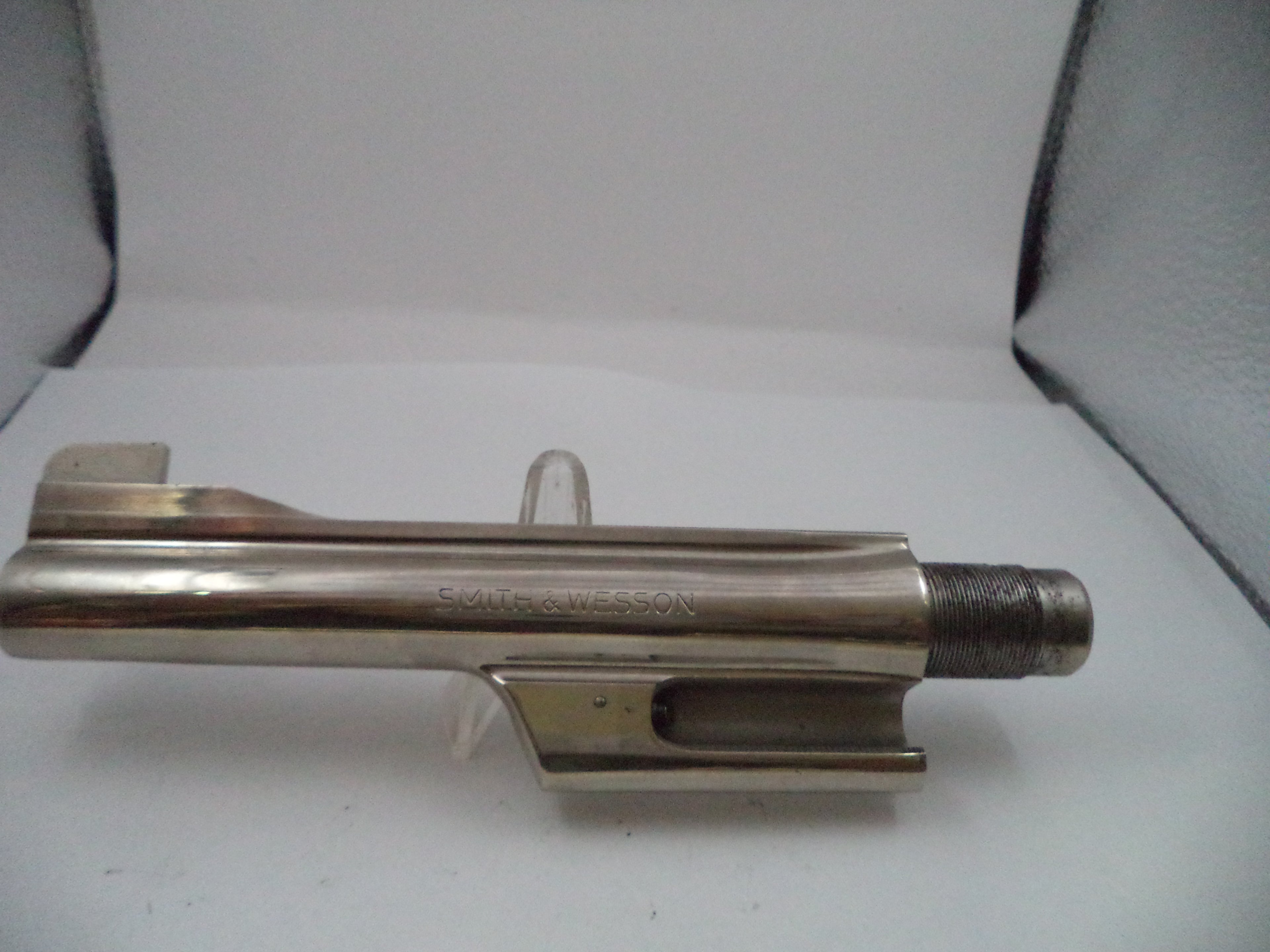 Metal tool or component on a white background