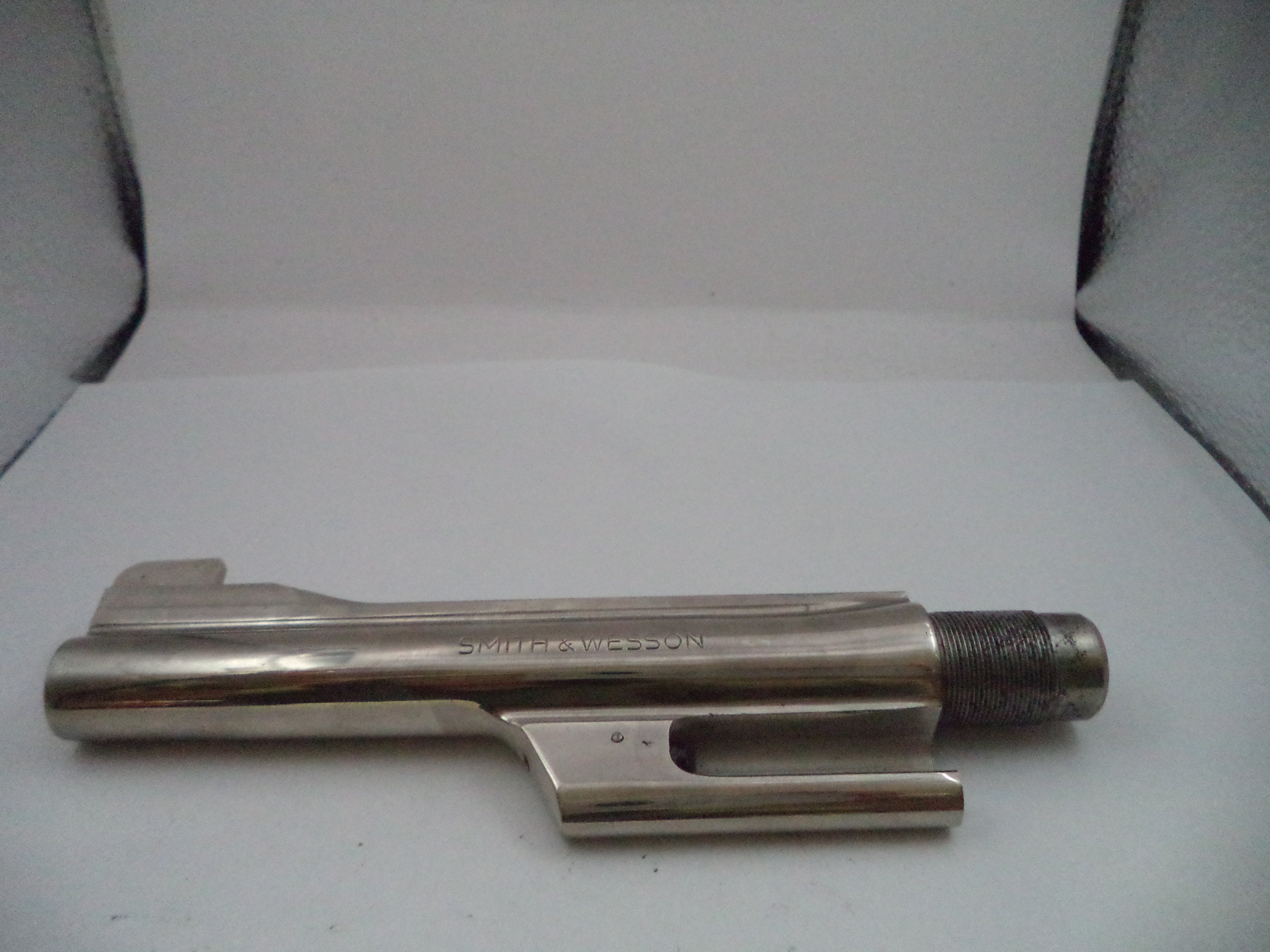 Metal tool or component on a white background