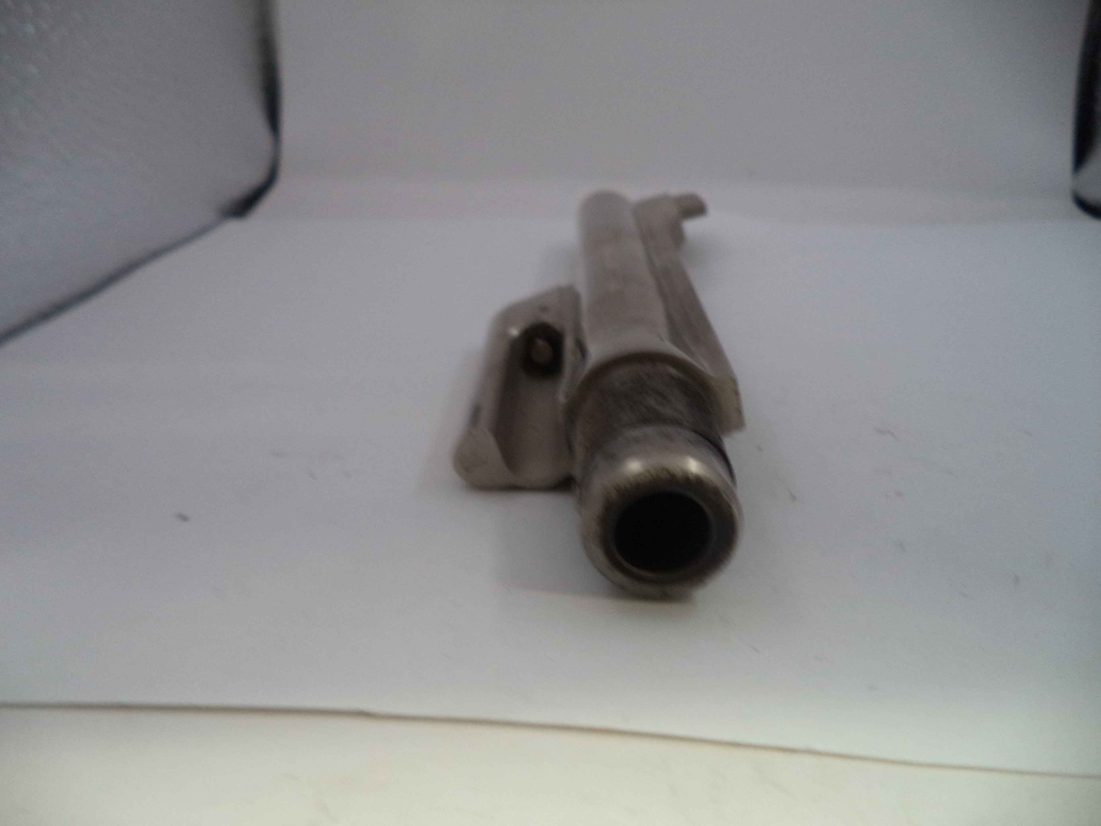 Metal pipe on a white surface