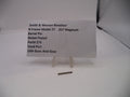 Smith & Wesson revolver barrel pin with a label on a white background