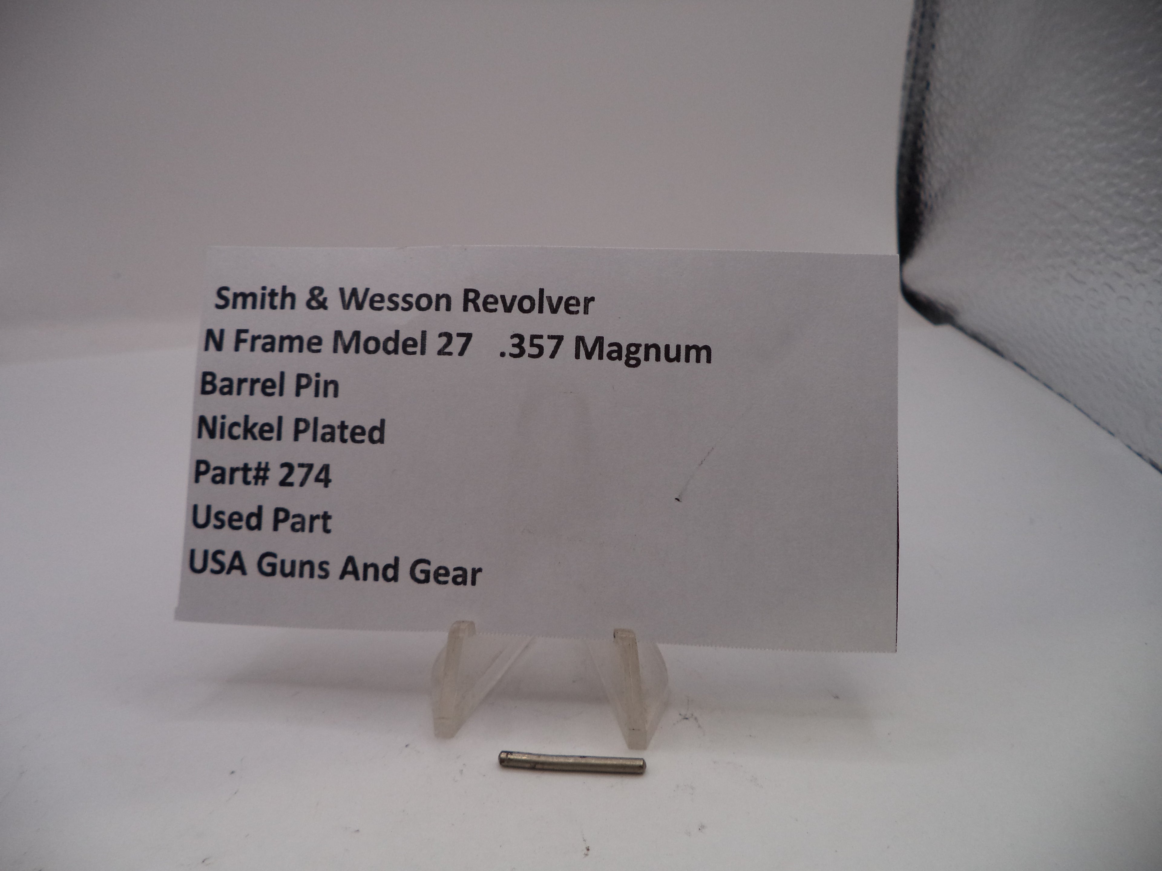 Smith & Wesson revolver barrel pin with descriptive card on a white background